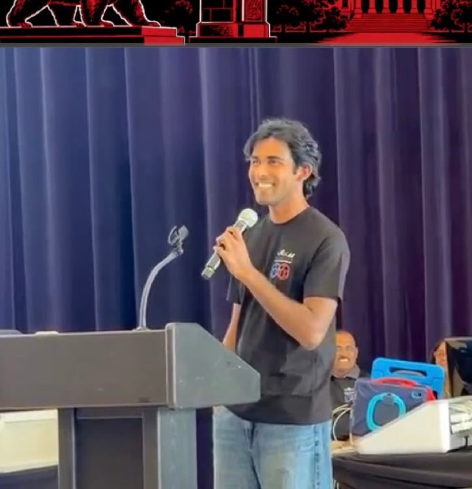 Arya Sasikumar speaking at the podium at the VEX AI World Championship
