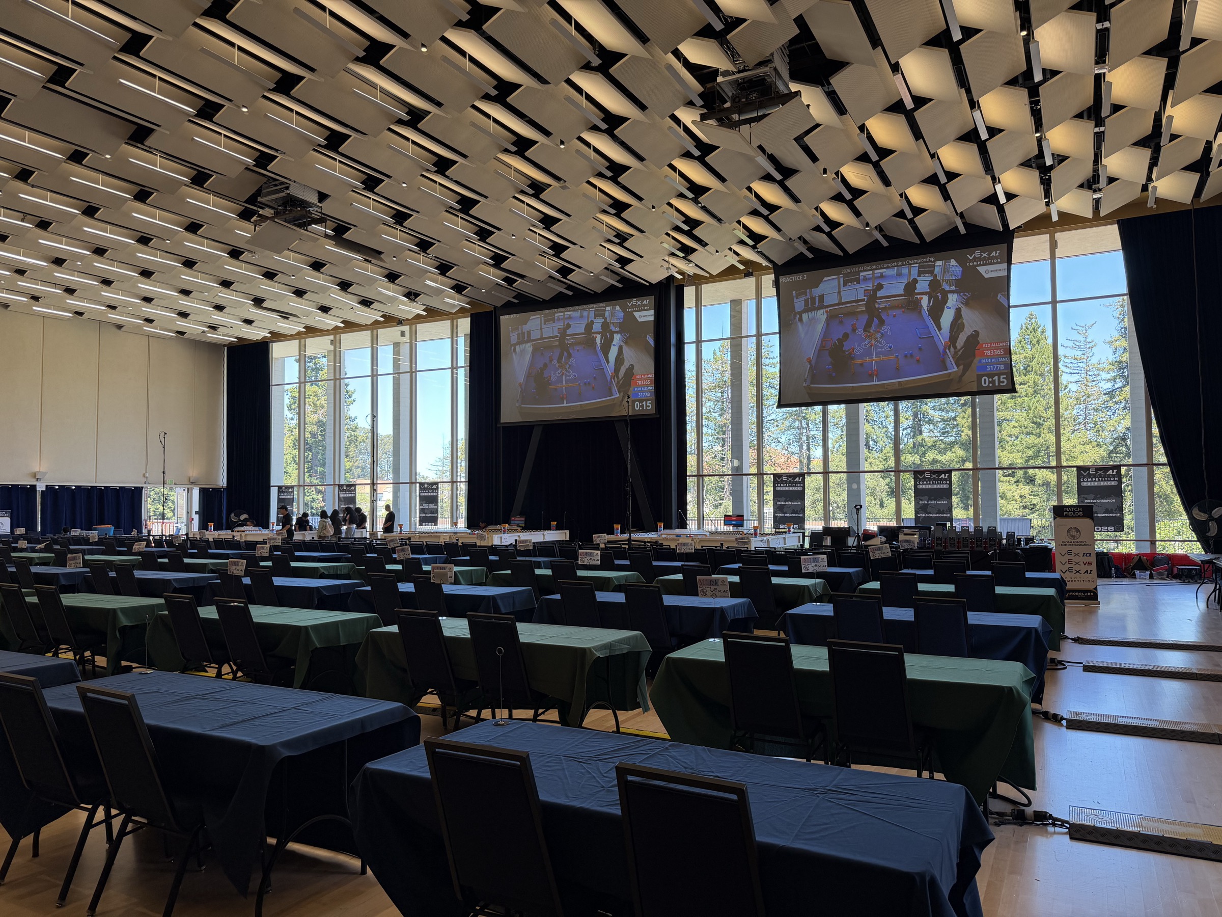 Pauley Ballroom set up for the VEX AI Robotics World Championship at UC Berkeley, June 2026, rows of team tables and the competition fields under the match screens