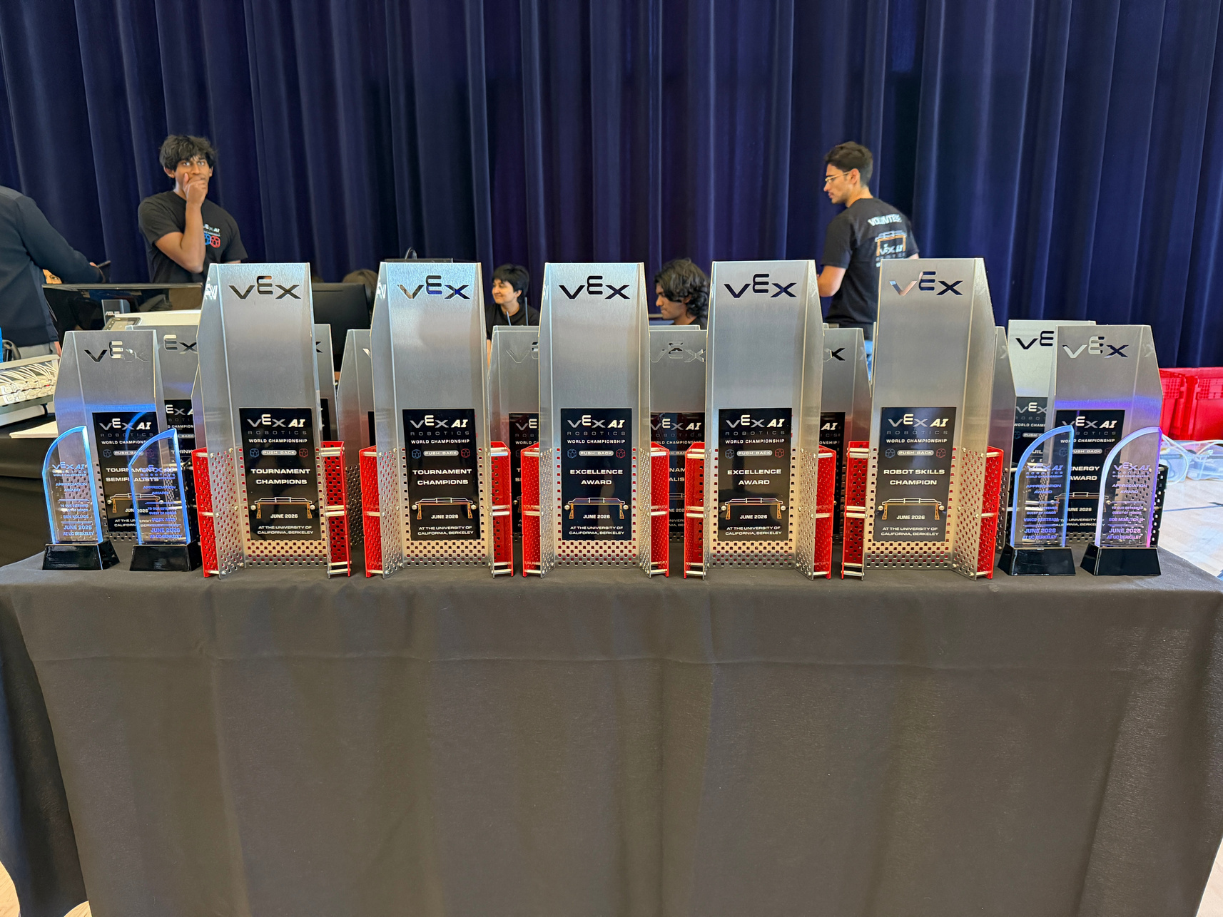 The trophy table at the VEX AI Robotics World Championship, UC Berkeley 2026, 21 trophies across 14 award categories laid out before the closing ceremony