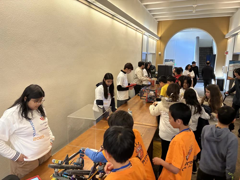 Teams and volunteers working in the pits at the Clark Kerr Campus