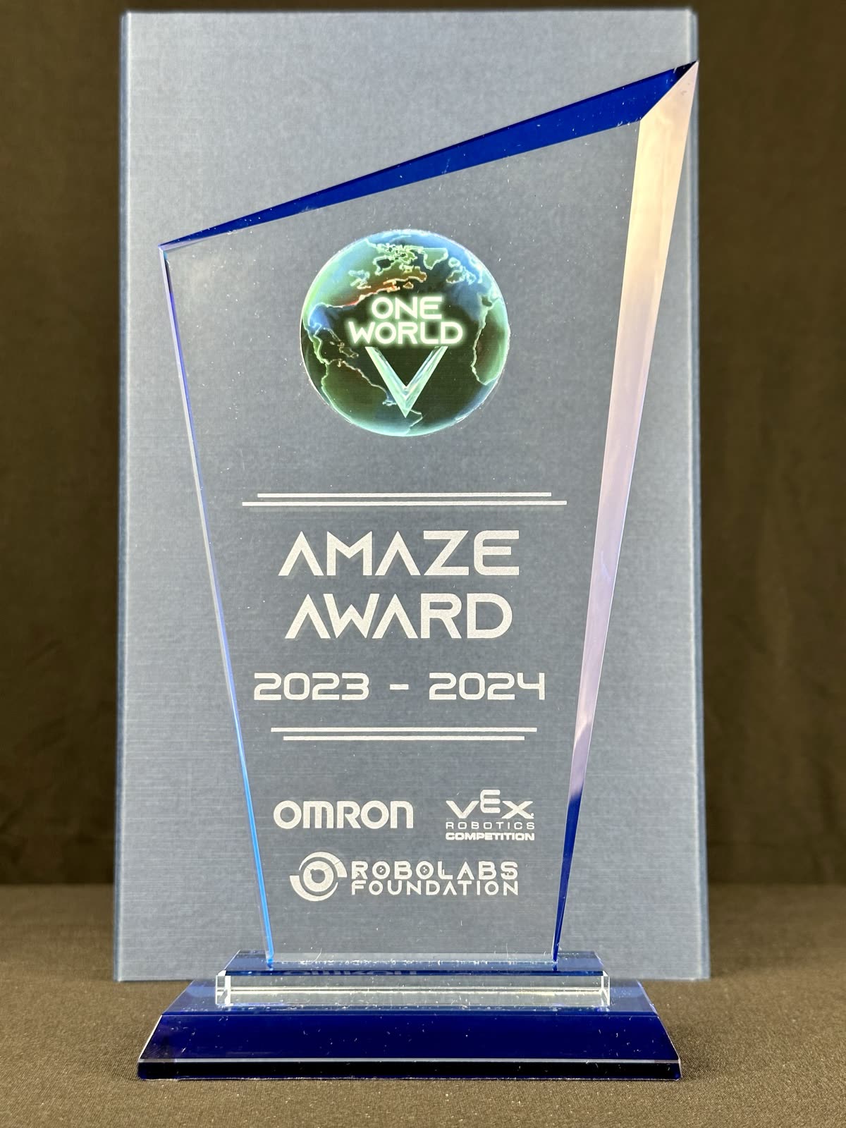 Glass Amaze Award trophy engraved with Omron, VEX and Robolabs Foundation marks