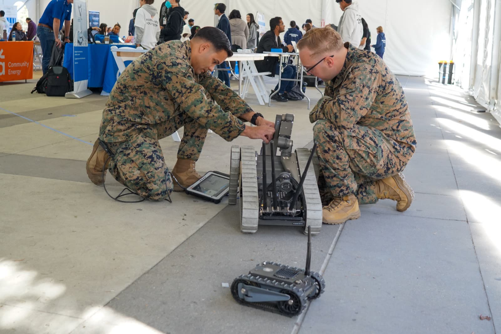 US Marine Corps EOD team demonstrating a tracked robot at the Expo