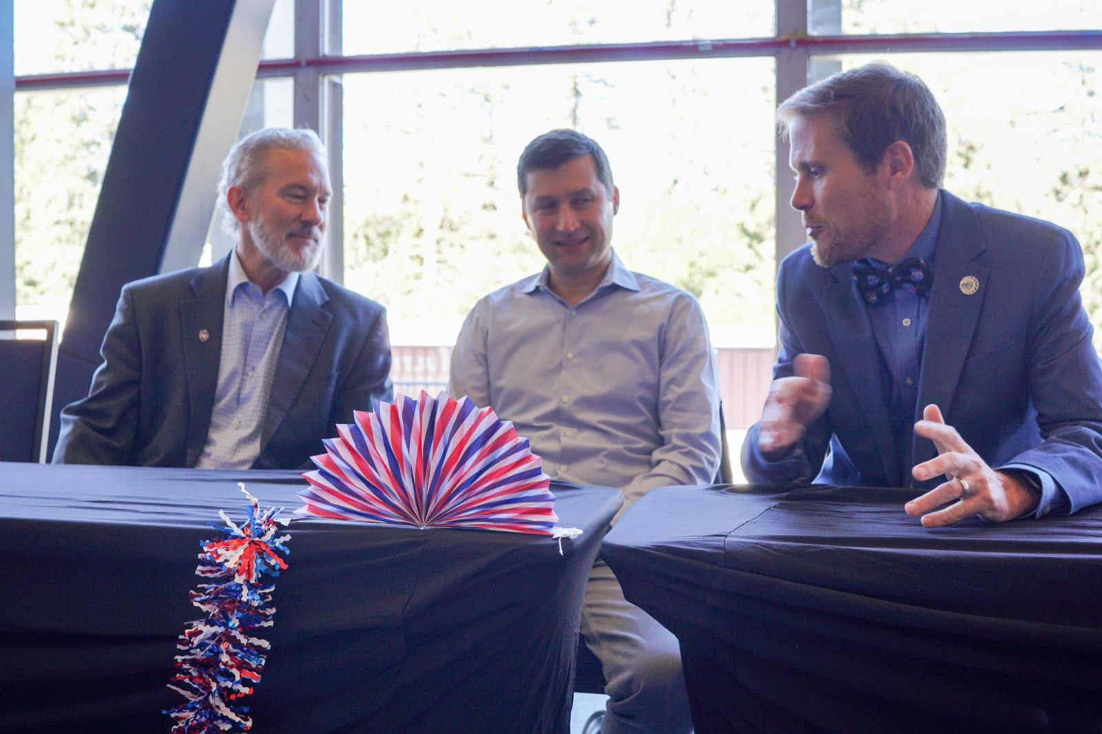 Chancellor Rich Lyons and Omron CEO Olivier Welker seated at the head table before the opening ceremony