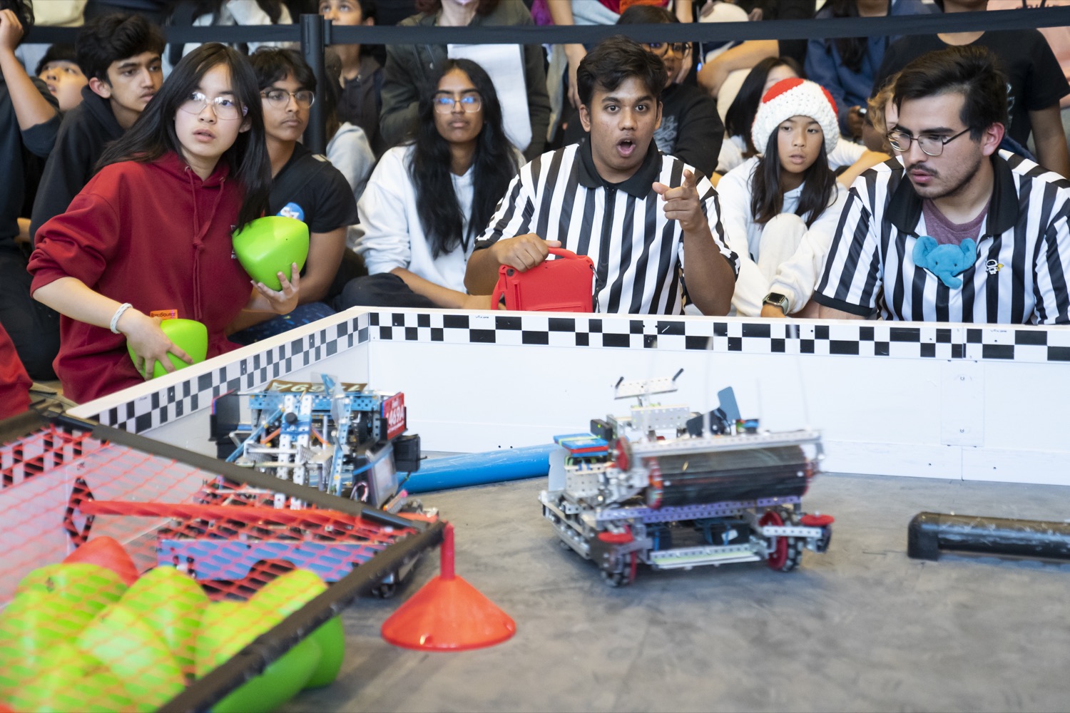 Qualification match in progress with referees and drivers at the field