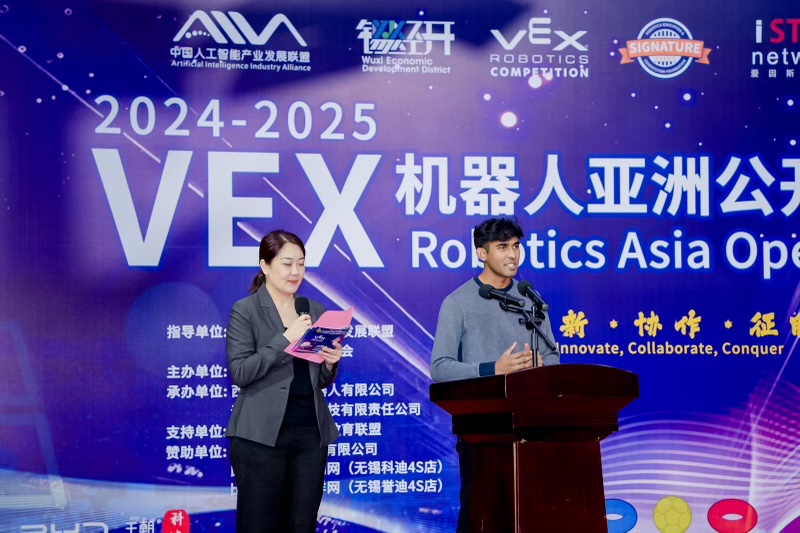 Delivering the opening address on stage