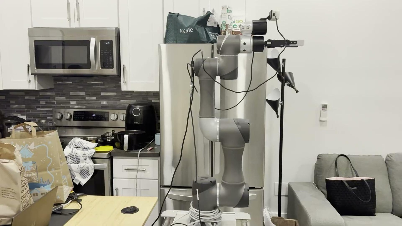 The GroceryGizmo rig running in a real kitchen - TM5-700 arm, wrist RealSense and Robotiq gripper