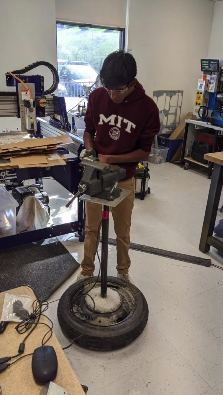 Machining a robot part at the vise during build season