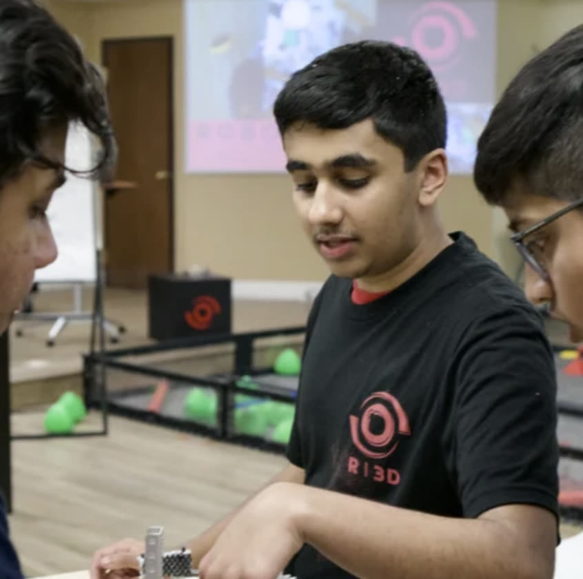 The Northern California Ri3D build team working on the robot during the three-day build